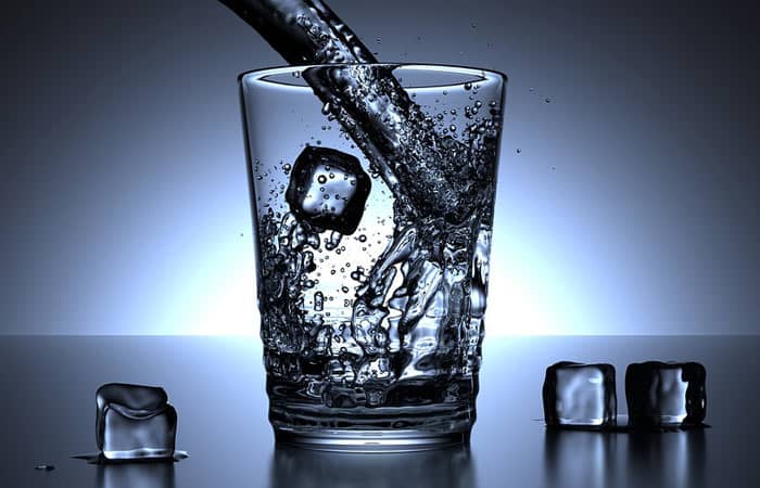 drinking water from a glass cup